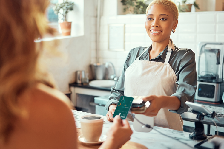 Woman paying with a VeraBank debit card.